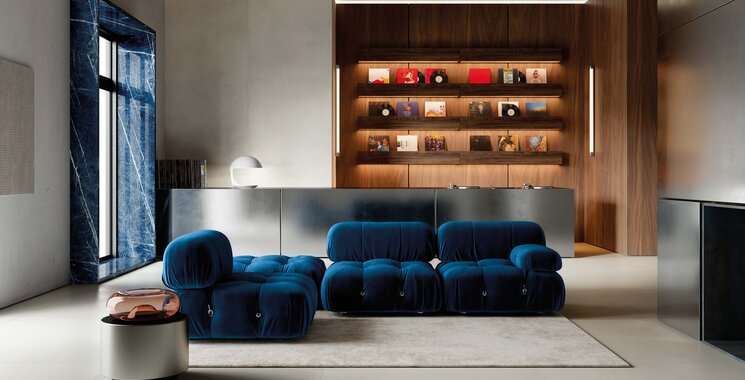 Highlight des Monats Mai 2026 Molarini Betonoptik moderner Wohnraum mit blauem Sofa Holzwand und großformatigem Boden