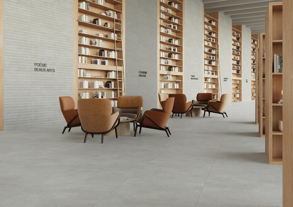 Graue Bodenfliesen in Natursteinoptik in moderner Bibliothek
